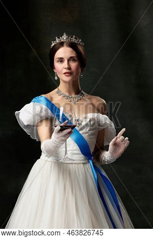 Queen Invites For Tasting. Young Charming Girl In Image Of Medieval Royal Person Or Viscountess Hold