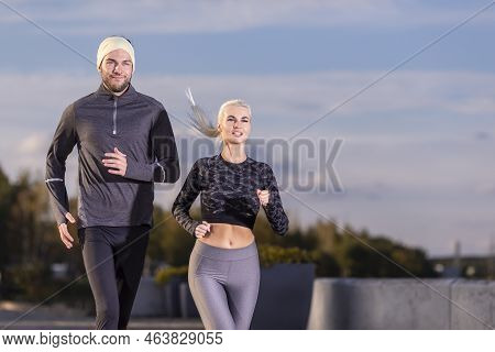Two Positive Caucasian Runners As Couple Training Together During Running Training Fitness Exercise