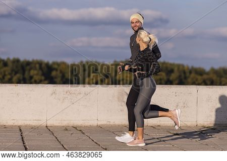 Two Positive Caucasian Runners Athletes Training Together During Running Training Fitness Exercise A