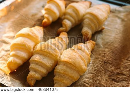 Freshly Baked Croissants With Crispy Crust On Baking Sheet. French Pastries For Breakfast, Sweet Cro