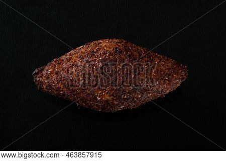 Roasted Kibe. Traditional Brazilian Snack. Isolated. Black Background