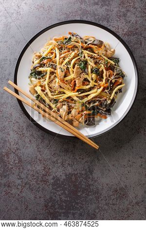 Stir-fried Glass Noodles And Vegetables Japchae Korea Food Closeup On The Plate On The Table. Vertic