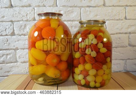 Tomatoes In A Jar. Red, Yellow Orange Fruits. Pickles. Proper Nutrition.