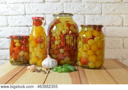Tomatoes In A Jar. Red, Yellow Orange Fruits. Pickles. Proper Nutrition.