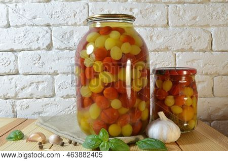 Tomatoes In A Jar. Red, Yellow Orange Fruits. Pickles. Proper Nutrition