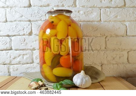 Tomatoes In A Jar. Red, Yellow Orange Fruits. Pickles. Proper Nutrition