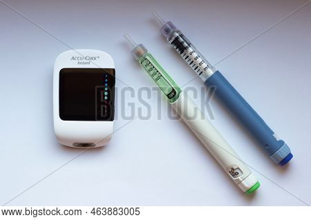 Poznan, Poland - 10.20.2022: Accu-chek Instant Glucose Meter With Toujeo Long Insulin And Apidra Sho
