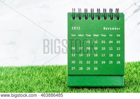 Green November 2022 Monthly Desk Calendar For 2022 Year On Grass.