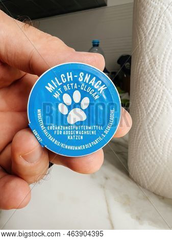 Paris, France - Sep 13, 2022: Pov Male Hand Holding Milch-snack With Beta Glucan Cat Food - Modern K