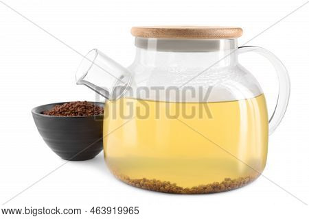 Glass Teapot With Aromatic Buckwheat Tea And Granules On White Background