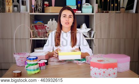 Gifts Wrapping. Attractive Woman, Designer Of Gifts And Decorations Shows Training Online, Records V