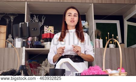 Designer Packing A Gift. Attractive Woman Decorator Conducts Online Broadcast, Conference, Records V