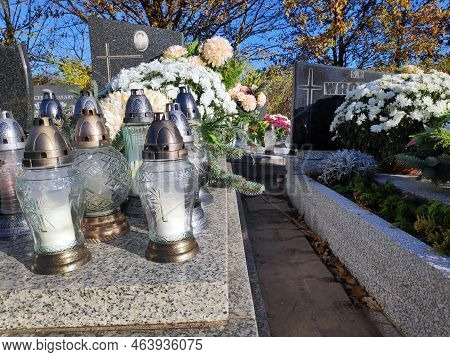 Bytom, Poland - November 1, 2021: Candles Lit On The Graves At A Cemetery On All Saints Day (wszystk