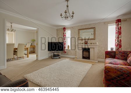 Stradishall, Suffolk, England - June 1 2017 Furnished Modern Living Room With Feature Rug And Firepl