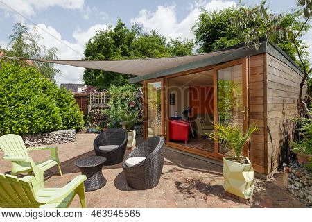 Stradishall, Suffolk, England - June 1 2017 Garden Room With Patio Furniture And Sun Shade