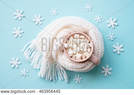 Hot Chocolate With Marshmallows And Knitting Scarf. Fflat Lay Image On Blue.