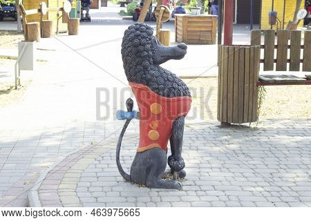 The Statue Of The Cute Poodle Artemon, The Hero Of The Fairy Tale Adventures Of Pinocchio Stands In 