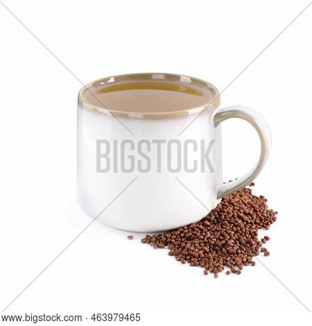 Cup Of Aromatic Buckwheat Tea And Granules On White Background
