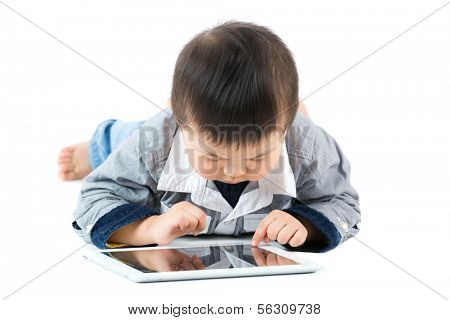 Little baby boy using tablet