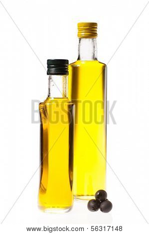 two closed bottles of olive oil isolated on white