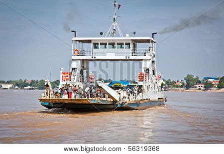 NEAK LEUNG, CAMBODIA - NOV 19, 2013: Ferry across the Mekong on Nov 19, 2013, in Neak Leung, Cambodia. Kingdom of Cambodia is a country located in Southeast Asia. Population of over 14.8 million.