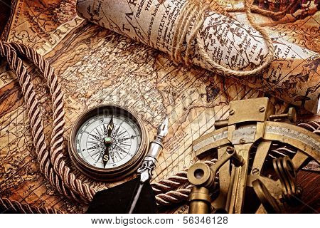 vintage still life with compass,sextant and old map.map used for background is in Public domain. Map source: Library of Congress. Country: Belgium Year: 1570. Author: Abraham Ortelius (1527-1598) 