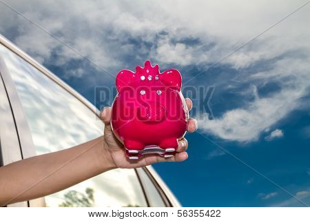 Woman Holding Piggy Bank.