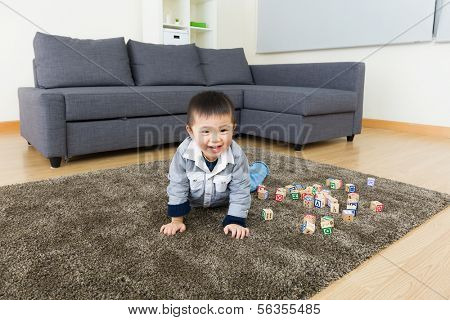 Little boy creeping at home