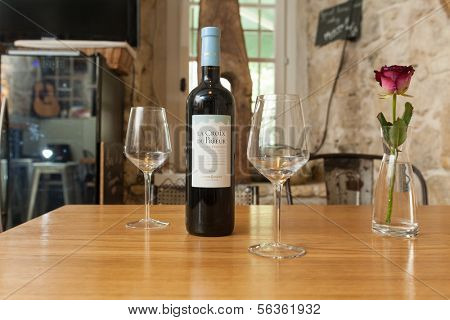 VENCE, FRANCE - SEPTEMBER 16: Table with wine and glasses at Bed and Bistrot on 16 September, 2013 in Vence, France. Bed and Bistrot is a new concept hotel in Vence.
