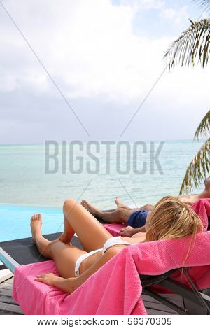 Relaxation time by the pool in Caribe