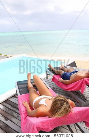 Relaxation time by the pool in Caribe