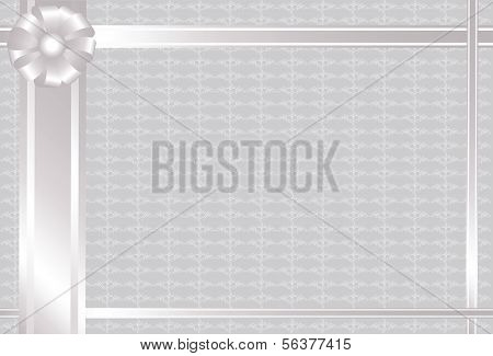 gray background with pattern and silver bow.