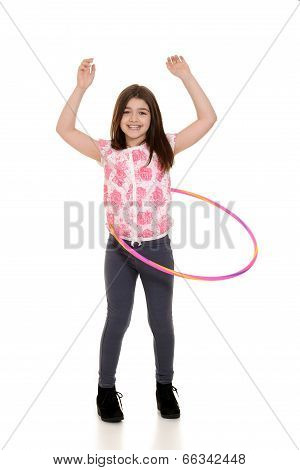 child playing with hula hoop