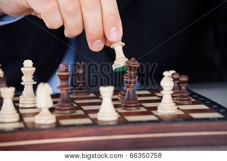 Human Hand Playing Chess