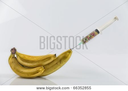 Banana And Syringe With Pills