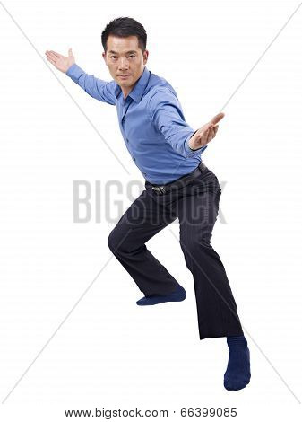 Asian Businessman Showing Karate Move