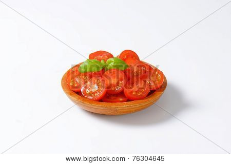 side view of bowl with halved cherry tomatoes