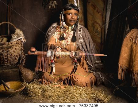 Weathered mature tribal female storyteller talking about heroic times