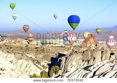 Hot air balloon flying over Cappadocia.