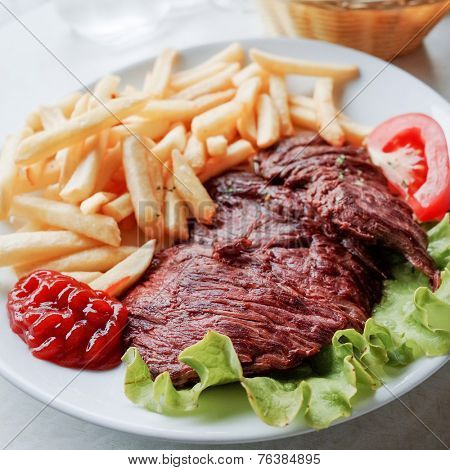 juicy steak beef meat with  french fries 