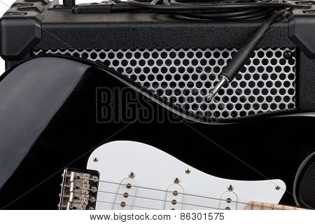 Guitar With Amplifier And Audio Cord With Jack Closeup