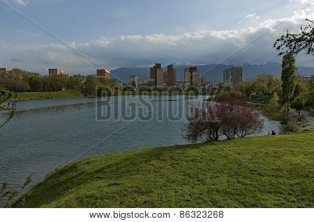 View to Vitosha mountain from lake in garden at quarter Drujba