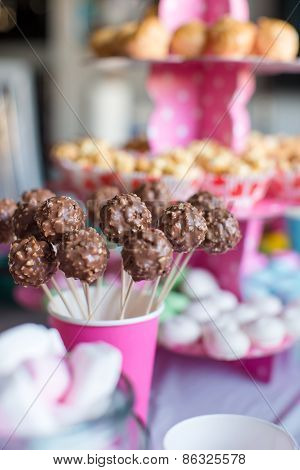 Chocolate cakepops on desert table at kid's birthday party