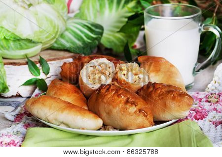 rustic still life with pies, cabbage and milk