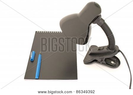 Reading-lamp And Notebook Isolated Over White