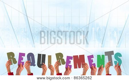 Hands holding up requirements against white room with large window overlooking city