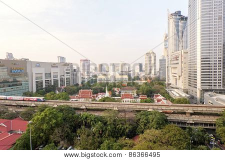 Bangkok,thailand-february 17:bangkok Mass Transit System (bts) Pass The Pathumwanaram Temple At Siam