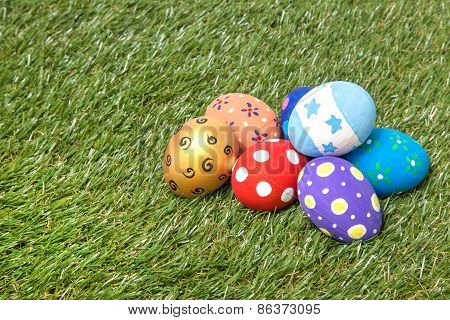 Pile Of Colorful Handmade Easter Eggs On Grass