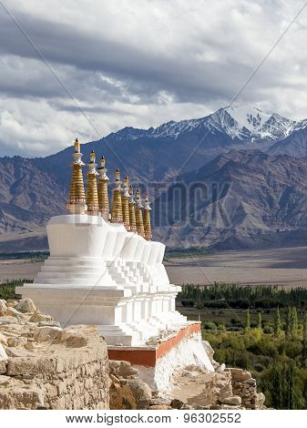 Buddhist Chortens (stupa) And Himalayas Mountains In The Background Near Shey Palace In Ladakh, Indi