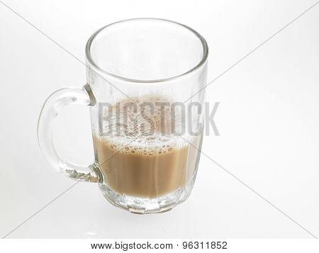 Half glass of Tea with milk or Teh Tarik in Malaysia